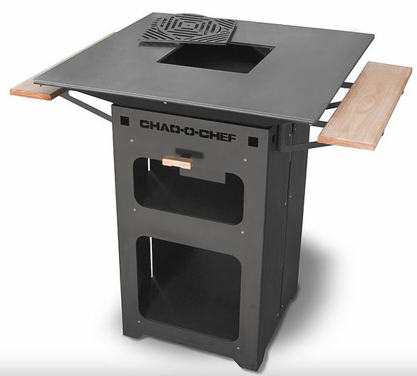 Chad-O-Chef Boma Braai in black steel with a square firebox, cast trivet and two timber side shelves