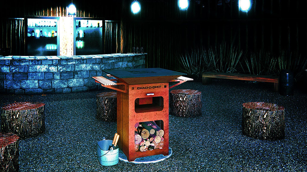 Chad-O-Chef Boma Braai in corten steel lit at night, with log stump seats and an outdoor bar behind it