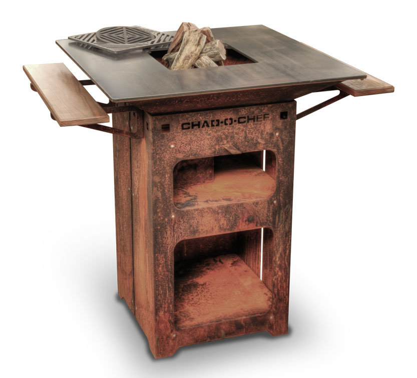 Chad-O-Chef Boma Braai in rusted corten steel with wood loaded in the firebox and timber side shelves