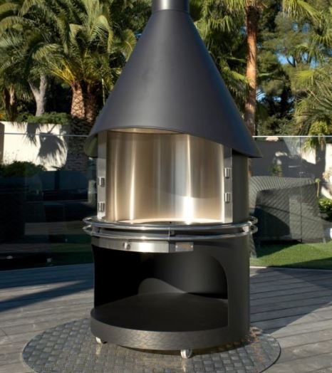 Single Safire Island cooker with a black cone hood over a glass-fronted firebox, outdoors on a deck
