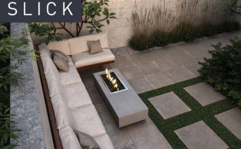 Slick: Slick low fire pit table in a courtyard